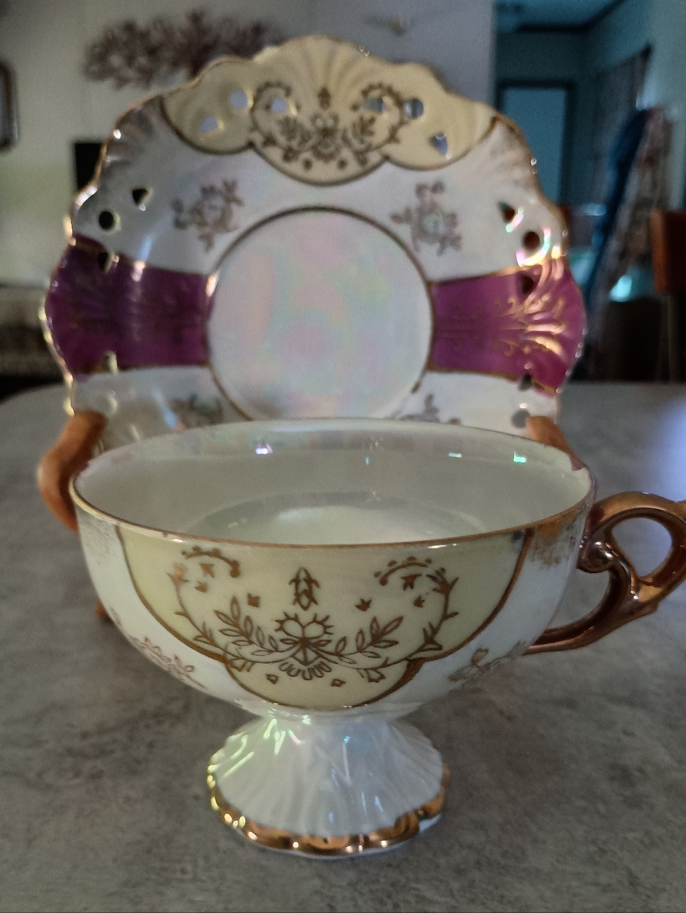 Enesco Cream and Purple Gilded Porcelain Footed Teacup and Saucer